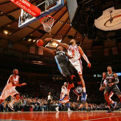 Tyson Chandler #6 of the New York Knicks attempts to block the shot of Jameer Nelson #14 of the Orlando Magic during the first half of the game on January 16, 2012 at Madison Square Garden in New York City