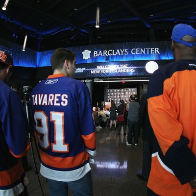 Fans congregate as New York Islanders owner Charles Wang announces the team's move to the Barclay Center in 2015 at a press conference at the Barclays Center on October 24, 2012 in the Brooklyn borough of New York City.