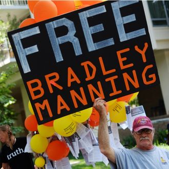 A protestor holds a placard calling for the release for Pfc. Bradley Manning outside of Ft McNair on July 26, 2013 in Washington, DC. The trial of Manning, accused of 