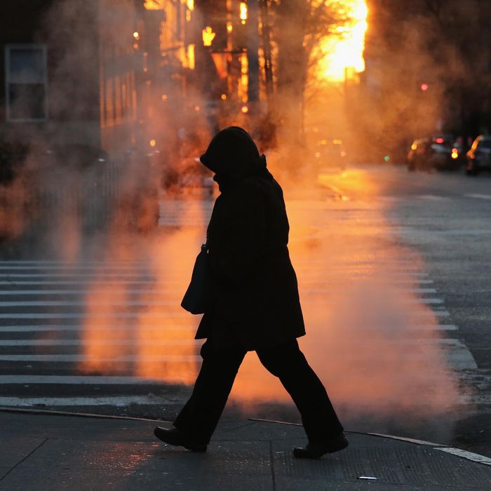 NEW YORK, NY - JANUARY 07: A pedestrian braves the cold on January 7, 2014 in New York City. A 'polar vortex' of frigid air centered on the North Pole dropped temperatures to a record low 4 degrees in New York City. (Photo by John Moore/Getty Images)