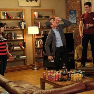 NEW GIRL: The gang plays drinking games when Jess (Zooey Deschanel, L) invites Russell (guest star Dermot Mulroney, C) to spend the weekend at the loft