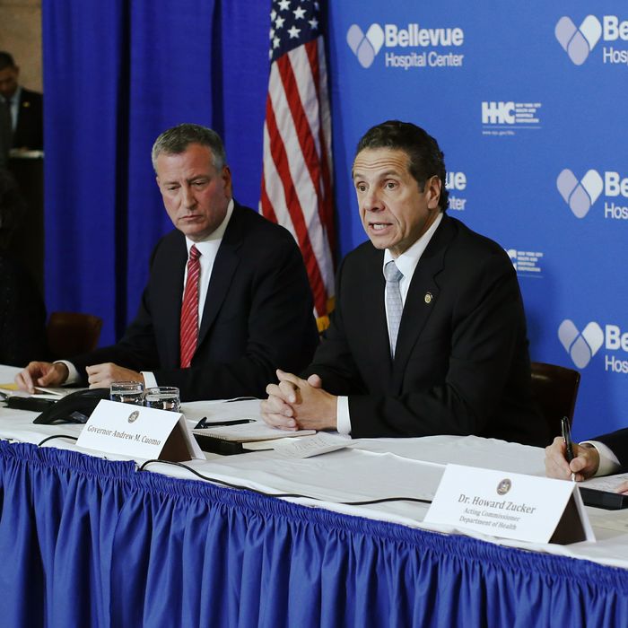 New York, United States. 23rd October 2014 -- New York Mayor Bill de Blasio and New York Governor Andrew Cuomo attend a press conference at Bellevue Hospital in Manhattan after a doctor who treated Ebola patients in West Africa before returning to New York tested positive for Ebola. -- A doctor who treated Ebola patients in West Africa before returning to New York has tested positive for Ebola. Dr Craig Spencer is thought to have contracted the virus while working for the charity Medecins Sans Frontieres in Guinea.