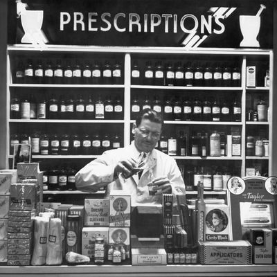 Pharmacist At Prescription Counter