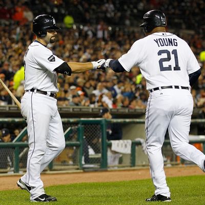 DETROIT - SEPTEMBER 28: Delmon Young #21 of the Detroit Tigers is congratulated by teammate Alex Avila #13 after scoring on a Victor Martinez single to right field in the fifth inning of the game against the Cleveland Indians during the game at Comerica Park on September 28, 2011 in Detroit, Michigan. The Tigers defeated the Indians 5-4. (Photo by Leon Halip/Getty Images)