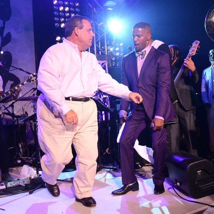 EAST HAMPTON, NY - AUGUST 16: New Jersey Governor Chris Christie dances onstage with Jamie Foxx at Apollo in the Hamptons at The Creeks on August 16, 2014 in East Hampton, New York. (Photo by Kevin Mazur/WireImage)