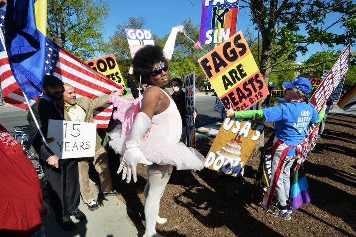 Both Sides of the Same-Sex Marriage Case Duel With Signs and Slogans  Outside the Supreme Court