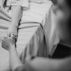 Nurse holding her patients hand