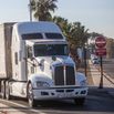 A truck drives into United States at the Otay Mesa Port of Entry, on the U.S.-Mexico border.