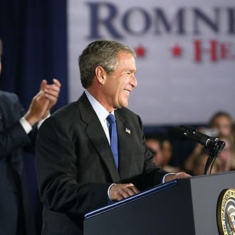 BOSTON, UNITED STATES: US President George W. Bush (R) addresses a one million USD Republican fundraiser for Massachusetts gubernatorial candidate Mitt Romney (L) at the Seaport Hotel o4 October, 2002 in Boston, Massachusetts. Both Bush and former president Bill Clinton are campaigning in the Bay State as Republicans try to extend a 12-year grip on the governorship of this otherwise Democratic-controlled commonwealth. The office is open because acting Governor Jane Swift, who moved up when Governor Paul Cellucci was named ambassador to Canada, stepped aside for Romney when polls showed he had a far better chance of winning. AFP PHOTO/TIM SLOAN (Photo credit should read TIM SLOAN/AFP/Getty Images)