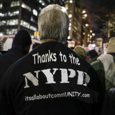 New York, United States. 19th December 2014 -- A man demonstrated outside of City Hall in support of the New York Police Department (NYPD). -- People demonstrating outside of City Hall in New York City against police violence, were met by another group in support of the New York Police Department. Even though the two sides opposed each other, no violence ensued.