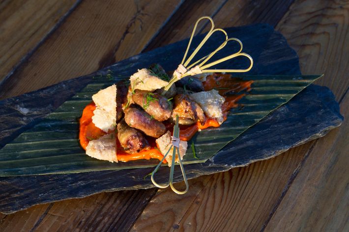 Grilled chicken heart skewer with chicken skin and pimentón aïoli.