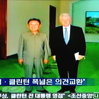 This frame grab from South Korean television taken in Seoul shows former US President Bill Clinton (R) and North Korea's leader Kim Jong-Il posing for a picture in Pyongyang on August 4, 2009. Former US president Bill Clinton arrived in North Korea 4 August on a surprise mission to free two jailed American journalists, the highest-profile visit by an American to Pyongyang for nearly a decade. RESTRICTED TO EDITORIAL USE AFP PHOTO/OFF TV (Photo credit should read OFF TV/AFP/Getty Images)