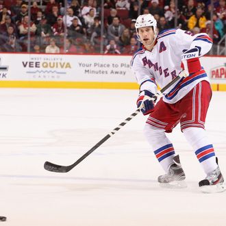 Dan Girardi #5 of the New York Rangers passes the puck during the NHL game against the Phoenix Coyotes at Jobing.com Arena on December 17, 2011 in Glendale, Arizona. The Rangers defeated the Coyotes 3-2.