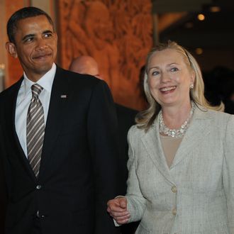 US President Barack Obama and US Secretary of State Hillary Clinton arrive for the East Asia Summit in Nusa Dua on Indonesia's resort island of Bali on November 19, 2011 following the Association of Southeast Asian Nations (ASEAN) Summit. The 16-nation East Asia Summit, which already includes China, India and Japan, expanded by two members as US President Barack Obama formally took his seat together with Russia. 