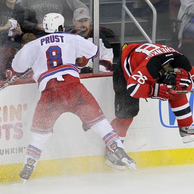 Brandon Prust #8 of the New York Rangers checks Anton Volchenkov #28 of the New Jersey Devils in Game Three of the Eastern Conference Final during the 2012 NHL Stanley Cup Playoffs at the Prudential Center on May 19, 2012 in Newark, New Jersey. 