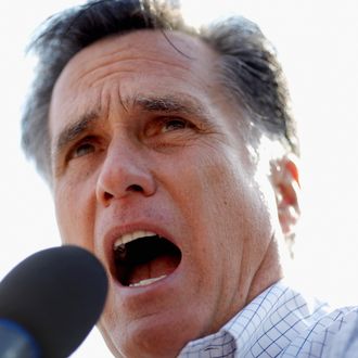 ROCKFORD, IL - MARCH 18: Republican presidential candidate, former Massachusetts Gov. Mitt Romney addresses supporters in an overflow crowd outside the Machine Shed Restaurant March 18, 2012 in Rockford, IL. Romney is campaigning in Illinois three days before that state’s primary elections March 21, when 54 GOP delegates are up for grabs. With Romney in the lead on delegates, fellow candidate, former Pennsylvania Sen. Rick Santorum continues to compete for the 1,444 necessary to secure the nomination before the last primary, in Utah on June 26. (Photo by Chip Somodevilla/Getty Images)