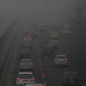 Vehicles drive in heavy smog on a highway near Beijing, China, 29 January 2013.The Ministry of Environmental Protection of China said satellite images showed smog covering an area of 1.3 million square kilometres by 10am on Tuesday, a third more than on Monday and spanning more than 10 municipalities and provinces. Serious air pollution was recorded in northern cities such as Beijing and Shijiazhuang and southern cities such as Wuhan and Chengdu . There was traffic chaos in many regions. The Ministry of Transport said Beijing shut down nine highways. Beijing Capital International Airport reported the cancellation of more than 50 flights. At Xinzheng International Airport in Zhengzhou , Henan, nearly 400 flights had been delayed or cancelled over the past two days.