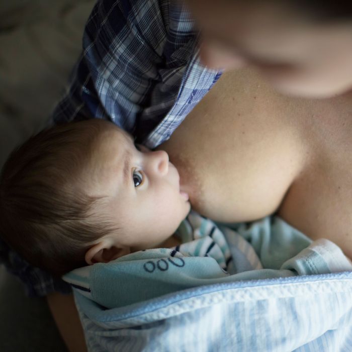 Women breastfeeding each other