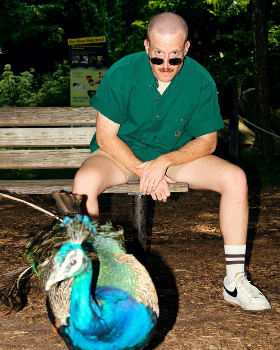 Andrew Lipstein and a peacock at the Prospect Park Zoo.