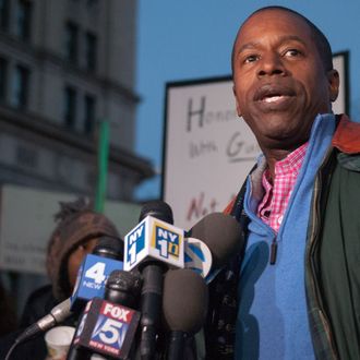 23 Dec 2012, New York City, New York State, USA --- New york, United States. 23rd December 2012 -- New York State Senate Majority Leader Malcolm Smith addresses an anti-gun rally on the Brooklyn Bridge in the wake of a mass shooting at Sandy Hook Elementary School in Newtown, Connecticut. -- Just days before Christmas, in an event called 'Hands Across the Brooklyn Bridge', New York politicians and civil rights activists, lead by civil rights attorney Norman Siegel and New York State Senator Eric Adams, called for tighter gun controls. --- Image by ? Julia Reinhart/Demotix/Corbis