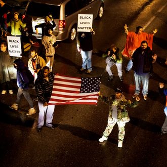 Protestors march through the streets of the Shaw neighborhood of St. Louis, Missouri during the ongoing demonstrations while awaiting the Grand Jury decision on whether or not to indict officer Daren Wilson for the shooting death of 18-year old Michael Brown on November 23, 2014. 