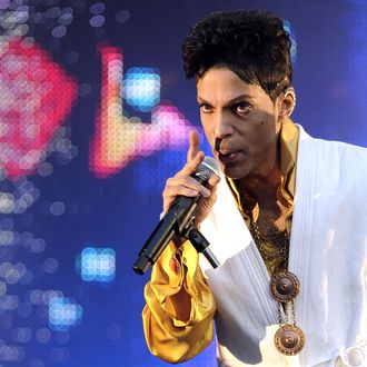 US singer and musician Prince (born Prince Rogers Nelson) performs on stage at the Stade de France in Saint-Denis, outside Paris, on June 30, 2011.