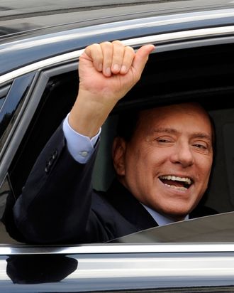 Italian prime minister Silvio Berlusconi waves as he leaves Milan's justice court on September 19, 2011. Italian Prime Minister Silvio Berlusconi was in court in Milan on Monday for a hearing into claims he paid to his former British lawyer David Mills 416,000 euros ($600,000) for false testimony about his business dealings. AFP PHOTO / GIUSEPPE CACACE (Photo credit should read GIUSEPPE CACACE/AFP/Getty Images)