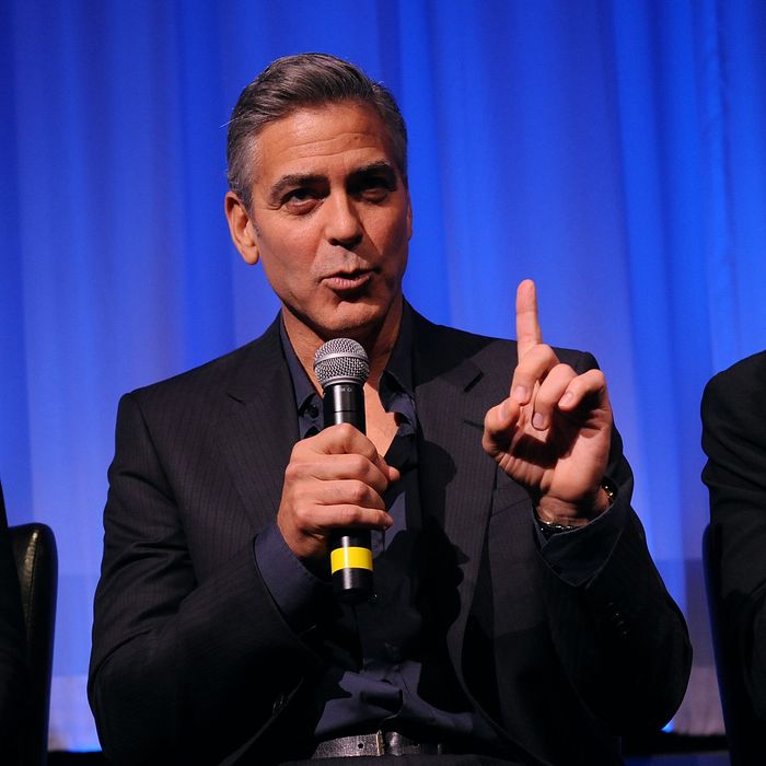 Actor George Clooney attends an official screening of