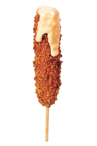 Asiadog’s tonkatsu corn dog revamps the fairground classic by dunking your choice of protein (organic beef, chicken, pork, or veggie) in a jalapeño-spiked buttermilk-cornmeal batter, then rolling it in panko bread crumbs and plunking it in the deep fryer. The grand finale: a squirt of katsu-spiked mayo. $6; 66 Kenmare St., nr. Mott St.; 212-226-8861.