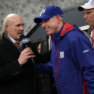 Head coach Tom Coughlin (R) of the New York Giants is interviewed by Terry Bradshaw after the Giants won 20-17 in overtime against the San Francisco 49ers during the NFC Championship Game at Candlestick Park on January 22, 2012 in San Francisco, California. 