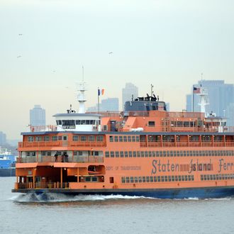 The Staten Island Ferry passes the Statue of Liberty as it makes it's ways south from Manhattan to Staten Island on January 15, 2010 in New York.