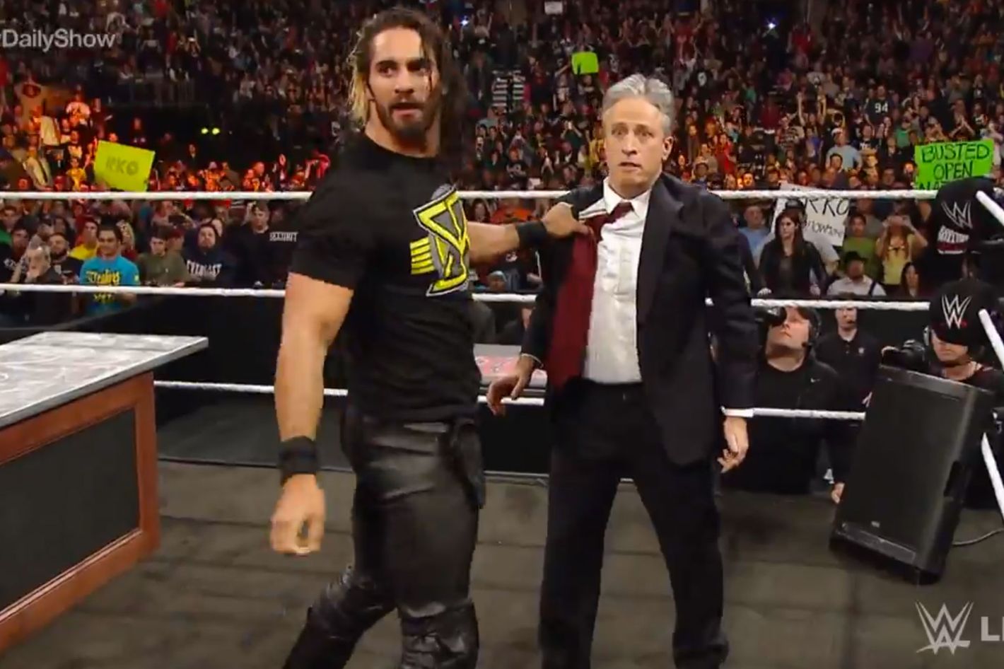 Watch Jon Stewart Knee Seth Rollins in the Nuts on WWE Raw