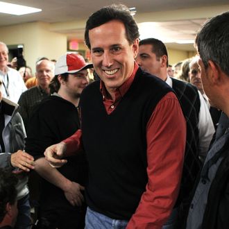 Republican presidential candidate, former U.S. Sen. Rick Santorum arrives at a town hall meeting on 