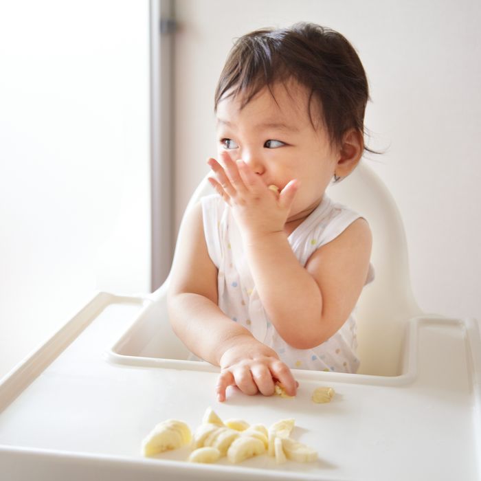 giving peanut butter to baby