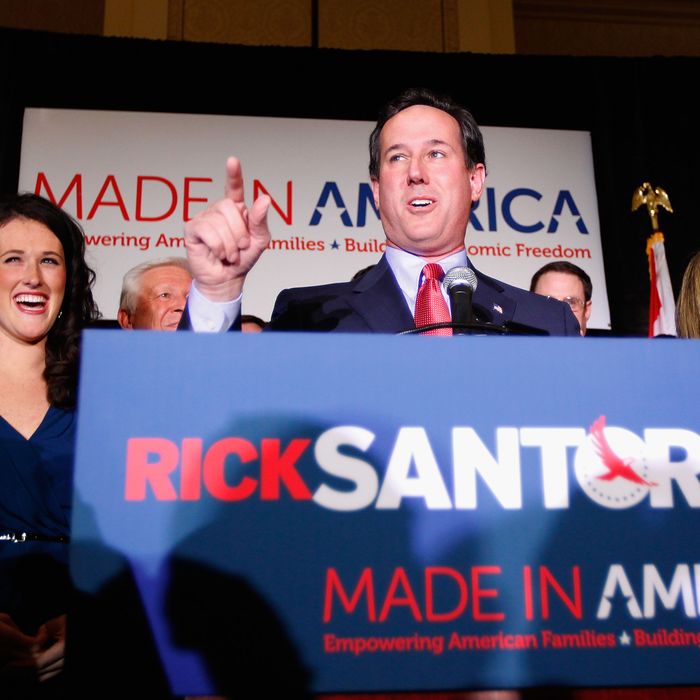 ST. CHARLES, MO - FEBRUARY 7: Republican presidential candidate, former U.S. Sen. Rick Santorum speaks to supporters as his daughter, Elizabeth (L), and wife, Karen (R), look on February 7, 2012 at the St. Charles Convention Center in St. Charles, Missouri. According to early results, Santorum defeated former Massachusetts Gov. Mitt Romney, former Speaker of the House Newt Gingrich and U.S. Rep. Ron Paul (R-TX) in Missouri, Minnesota and is leading in Colorado. (Photo by Whitney Curtis/Getty Images)