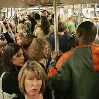 Subway passengers ride a crowded L train October 9, 2005 in New York City. New Yorkers continued to ride the subway today, the date officials warned of a possible terror attack on the subway. (Photo by Mario Tama/Getty Images)