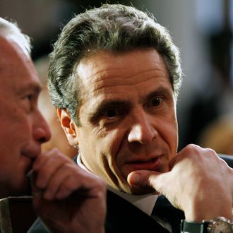 New York City Mayor Michael Bloomberg, left, and New York Gov. Andrew Cuomo during a ceremony in the Red Room at the Capitol in Albany, N.Y., on Friday, March 16, 2012. (AP Photo/Mike Groll)