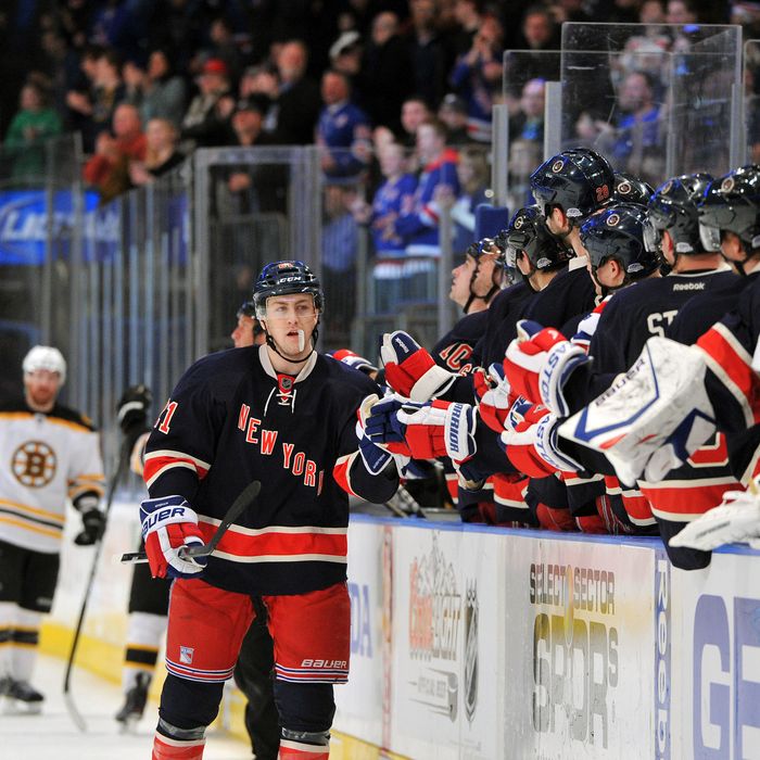 Derek Stepan #21 of the New York Rangers is congratulated after scoring the game winning goal during the third period against the Boston Bruins at Madison Square Garden on March 4, 2012 in New York City. 