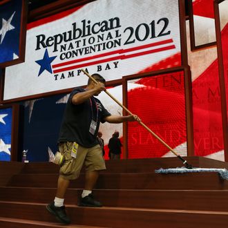 TAMPA, FL - AUGUST 26: A worker sweeps the steps of the stage ahead of the Republican National Convention at the Tampa Bay Times Forum on August 26, 2012 in Tampa, Florida. The RNC is scheduled to convene on August 27 and will hold its first full-day session on August 28 as Tropical Storm Isaac threatens disruptions due to its proximity to the Florida peninsula. (Photo by Spencer Platt/Getty Images)