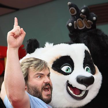 You see a middle-aged man acting out next to a cartoon character. We see commendably dry pits.