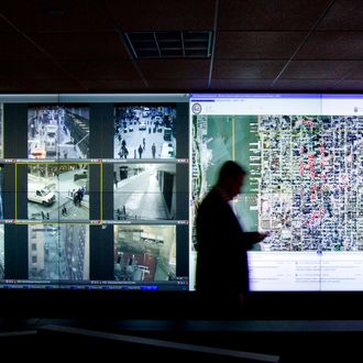 Monitors display live video feed from various locations around the city at the New York Police Department surveillance headquarters in New York, U.S., on Monday, Nov. 22, 2010. 