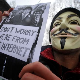 A protester wearing an Anonymous Guy Fawkes mask takes part in a demonstration against controversial Anti-Counterfeiting Trade Agreement (ACTA) as part of an international day of action against the increasingly-contested accord, in Zagreb on February 11, 2012. Tens of thousands of people marched in protests in more than a dozen European cities against a controversial anti-online piracy pact that critics say could curtail Internet freedom. ACTA was signed last year in Tokyo, and aims to bolster international standards for intellectual property protection, for example by doing more to fight counterfeit medicine and other goods. But its attempt to attack illegal downloading and Internet file-sharing has sparked angry protests from users, who fear it could curtail online freedom. AFP PHOTO / HRVOJE POLAN (Photo credit should read HRVOJE POLAN/AFP/Getty Images)