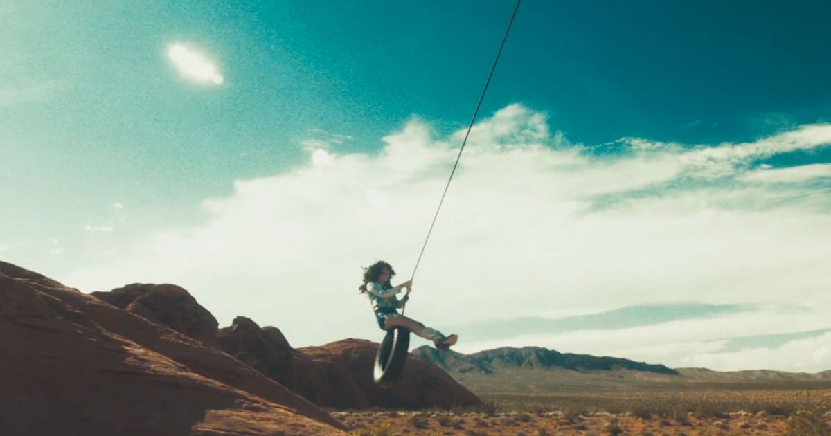 ‘Ride’ Video: Lana Del Rey Has a Gun, a Tire Swing, Curly Hair