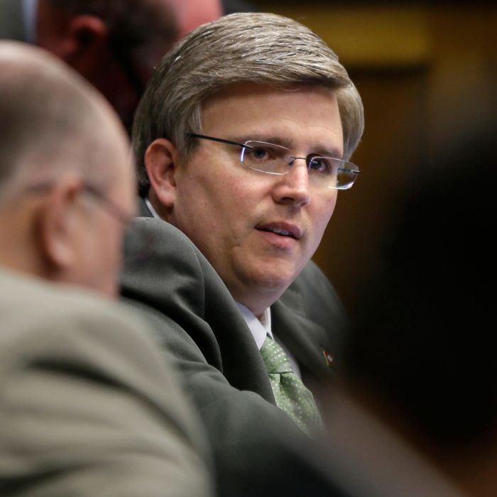 In this Feb. 26, photo, Rep. Justin T. Harris, R-West Fork, questions a witness during a meeting of the House Committee on Education at the Arkansas state Capitol in Little Rock, Ark. Arkansas Gov. Asa Hutchinson has instructed the state to review adoption procedures after Harris gave his adopted daughters to a man who admitted to sexually abusing one of them. (AP Photo/Danny Johnston)