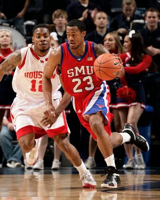 Paul McCoy #23 of the SMU Mustangs brings the ball upcourt past Aubrey Coleman #12 of the Houston Cougars during Round One of the Conference USA Basketball Tournament at FedExForum on March 11, 2009 in Memphis, Tennessee.