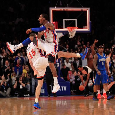 (L) Steve Novak #16 of the New York Knicks and (R) J.R. Smith #8 of the New York Knicks chest bump after Novak hits a three pointer at the end of the first quarter against the Orlando Magic at Madison Square Garden on March 28, 2012 in New York City. 