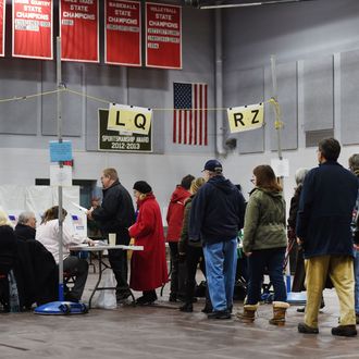 Citizens line up to vote at Belmont High School February 9, 2016 in Belmont, New Hampshire. Voting began in New Hampshire on February 9 in the first US presidential primary, where Donald Trump leads the packed Republican field and Bernie Sanders was polling ahead of Hillary Clinton. 