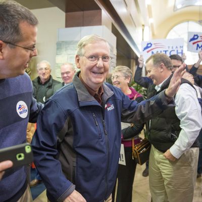 U.S. Sen. Mitch McConnell (R-KY) (L) greets supporters following an election rally at Bluegrass Airport November 3, 2014 in Lexington, Kentucky. 
