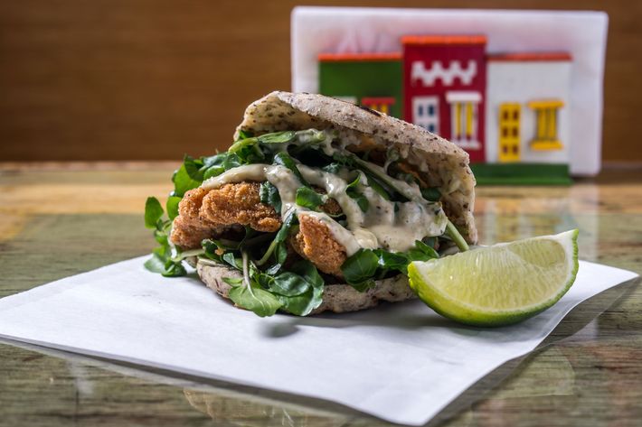 Inglesa in the chia-flaxseed arepa (breaded fish with watercress and tartar sauce).