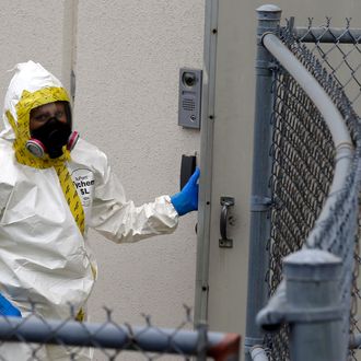 A Prince George's County, Md. firefighter dressed in a protective suit walks into a government mail screening facility in Hyattsville, Md., Wednesday, April 17, 2013. Police swept across the U.S. Capitol complex to chase a flurry of reports of suspicious packages and envelopes Wednesday after preliminary tests indicated poisonous ricin in two letters sent to President Barack Obama and a Mississippi senator. (AP Photo/Alex Brandon)